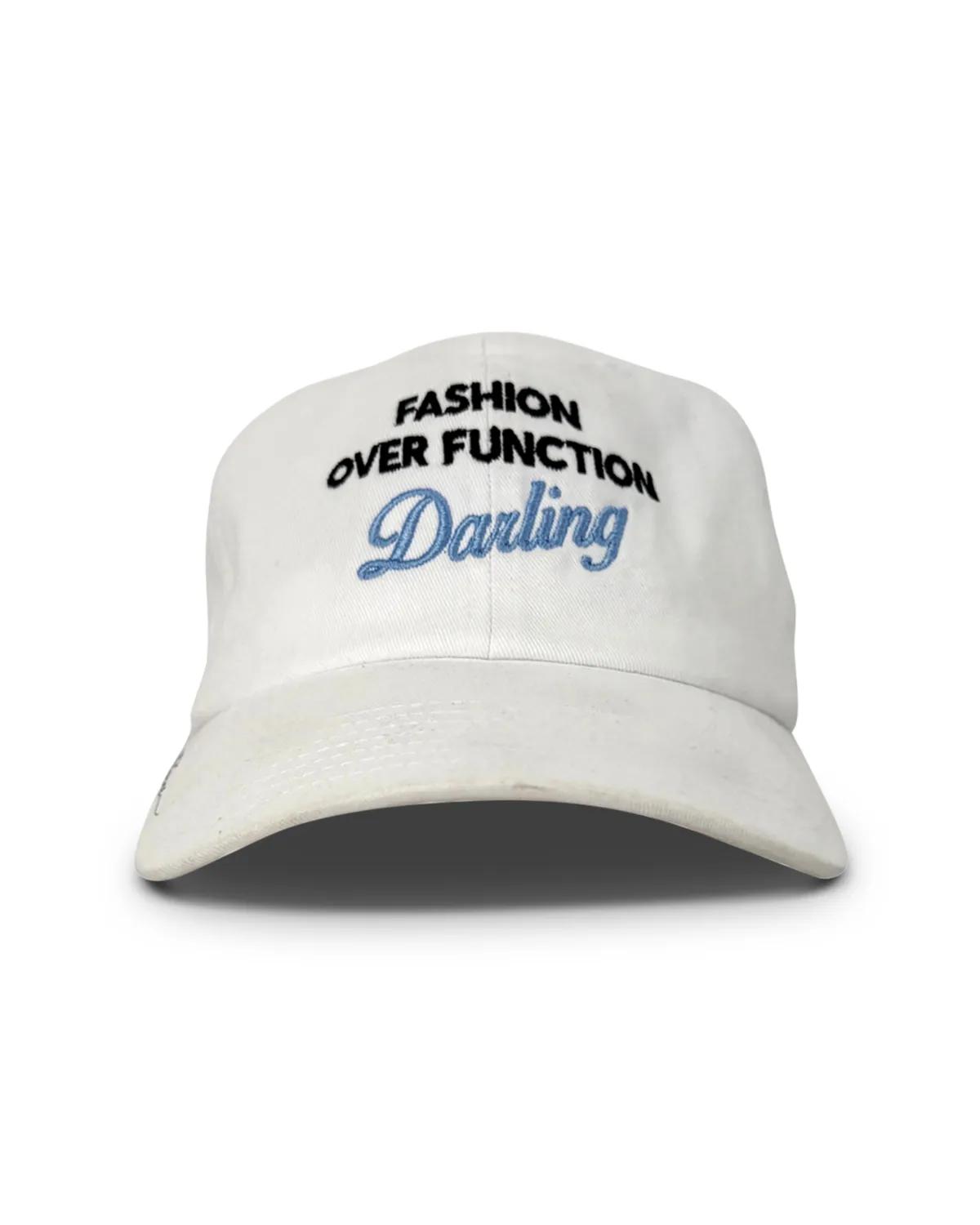 White unstructured dad cap, front view, with FASHION OVER FUNCTION arched above Darling in blue script